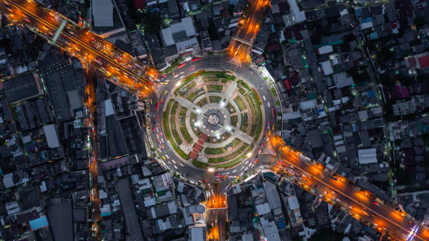 istock Aerial view elevated road traffic junctions, Modern construction design traffic ways traffic jams, Road interchange or highway intersection with busy urban traffic Junction network of transportation. 2177789737