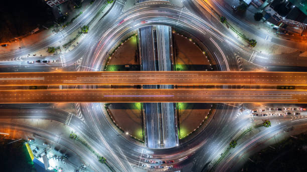 istock Aerial view elevated road traffic junctions, Modern construction design traffic ways traffic jams, Road interchange or highway intersection with busy urban traffic Junction network of transportation. 2177789738