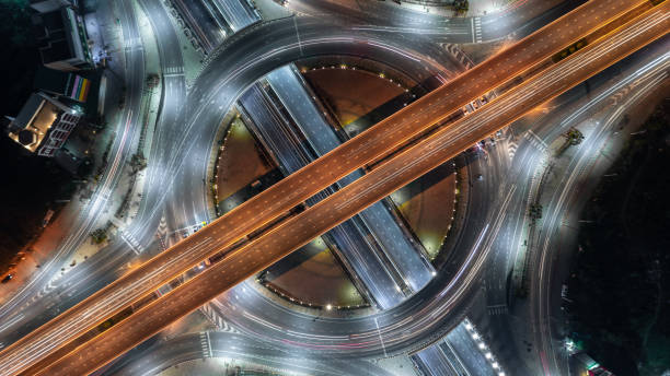 istock Aerial view elevated road traffic junctions, Modern construction design traffic ways traffic jams, Road interchange or highway intersection with busy urban traffic Junction network of transportation. 2177789755