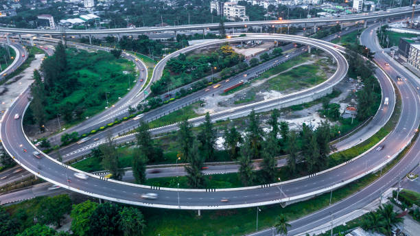 istock Aerial view elevated road and traffic junctions, Modern construction design traffic ways traffic jams, Road interchange or highway intersection with busy urban traffic Junction network of transportation. 2177789770