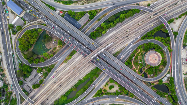 istock Aerial view elevated road and traffic junctions, Modern construction design traffic ways traffic jams, Road interchange or highway intersection with busy urban traffic Junction network of transportation. 2177789814