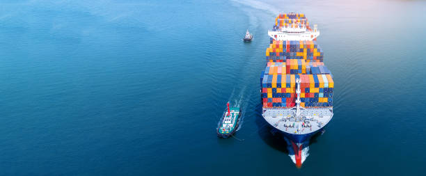 istock Cargo container ship carrying container and running out from international container port customs shipyard sea port concept smart logistic service. Container Ship freight export 2177790362