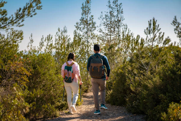 istock Back view of backpackers hiking 2177791514