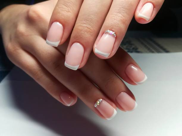 istock Manicure gel polish nude and French 2177791663