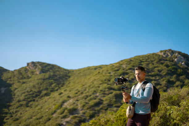 istock Photographer filming with tripod in nature 2177791667