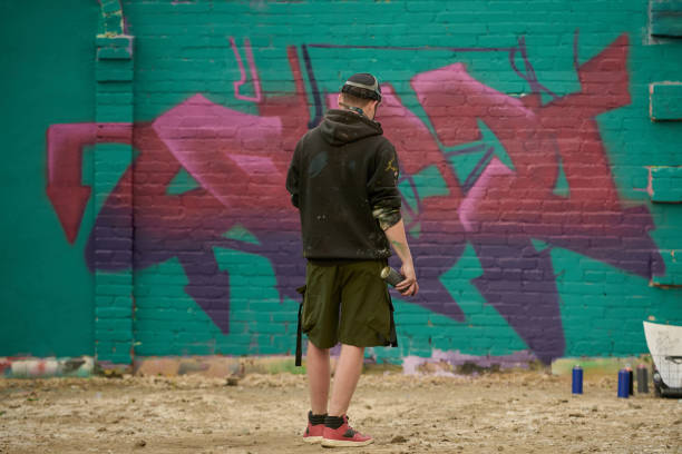istock Creative male graffiti artist with paint 2177792603
