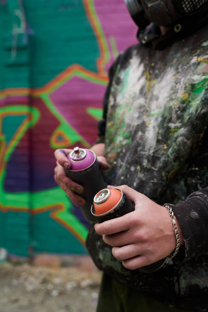 istock Graffiti paints in hands of creative man 2177792619