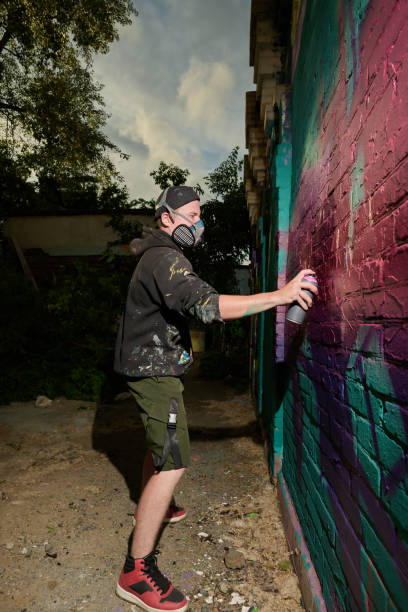 istock Spraying paint from dispenser on wall 2177792628