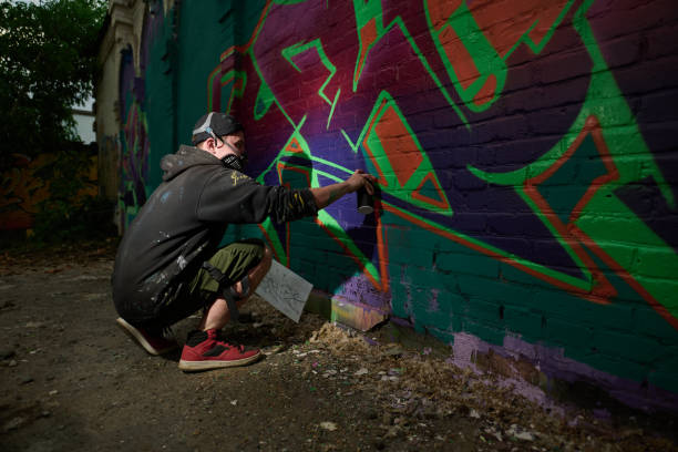 istock Standing on squats and painting on wall 2177792645