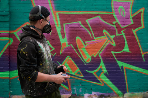 istock Graffiti artist with cans with paints 2177792667