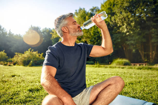 istock A relaxed man is enjoying practicing mindfulness in nature while carrying a water bottle with him 2177801987