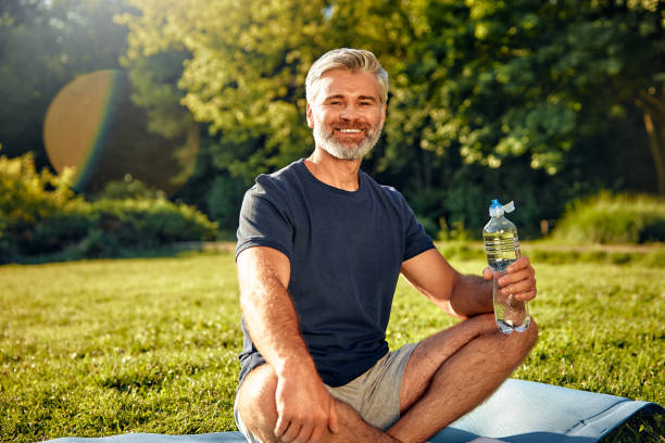 istock A relaxed man is enjoying practicing mindfulness in nature while carrying a water bottle with him 2177801995