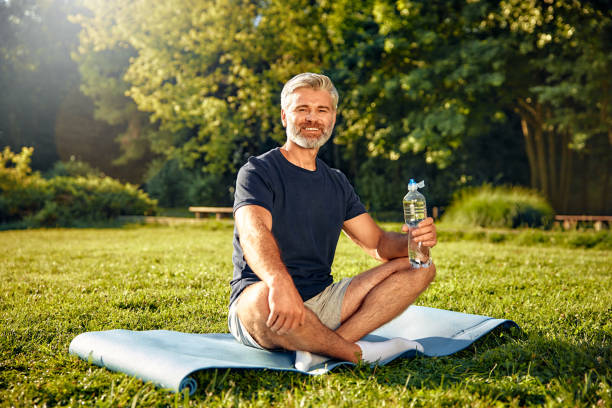 istock A relaxed man is enjoying practicing mindfulness in nature while carrying a water bottle with him 2177801996