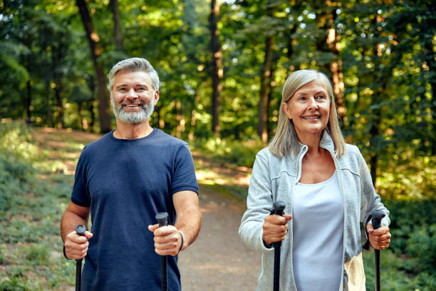 istock Active and Engaged Seniors Delight in a Nature Walk in the Park Using Nordic Poles 2177802052