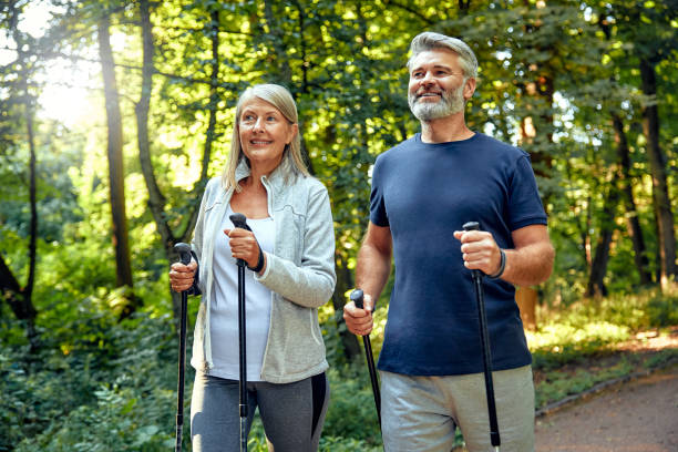 istock Active and Engaged Seniors Delight in a Nature Walk in the Park Using Nordic Poles 2177802072