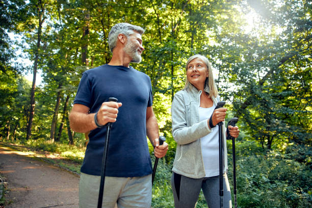 istock Active and Engaged Seniors Delight in a Nature Walk in the Park Using Nordic Poles 2177802083