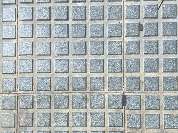 A pattern of grey stone tiles in a Spanish village close up