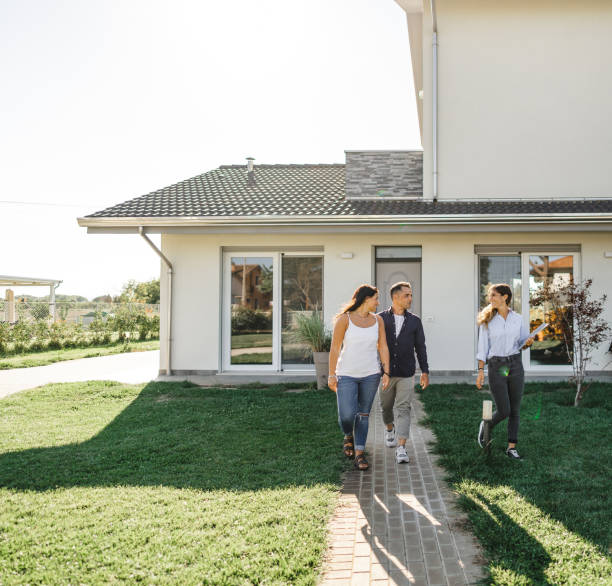 istock real state agent showing the new house 2177803864