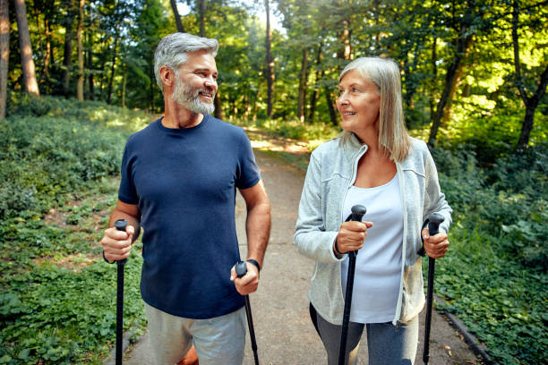 istock Active and Engaged Seniors Delight in a Nature Walk in the Park Using Nordic Poles 2177804461