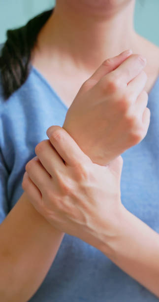 istock asian woman has wrist pain 2177809390