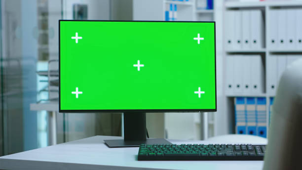 istock Dolly shot of computer with green screen 2177810231