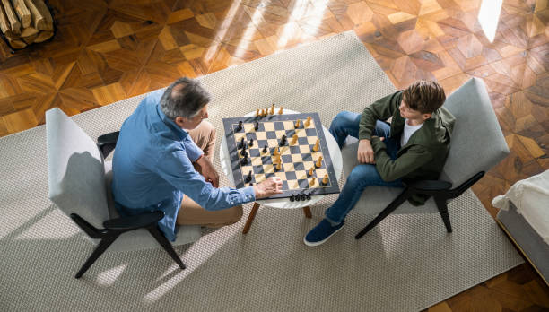 istock Generational Bond Through Chess Strategy at Home 2177812651