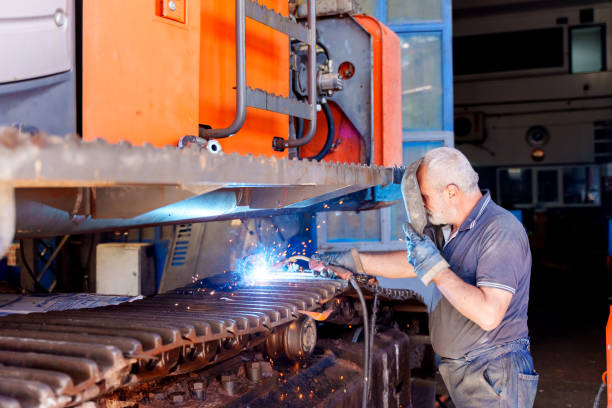istock a mechanic engaged in welding work on a large industrial machine 2177813653