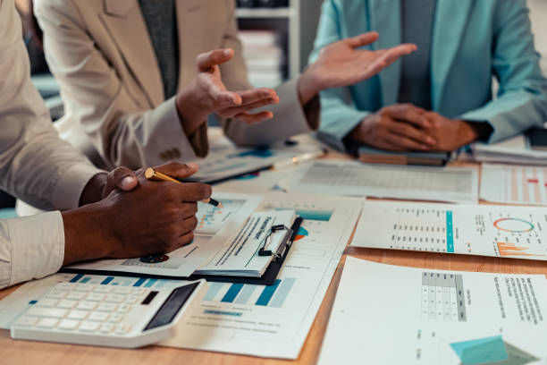 istock Meeting with accounting fund managers to plan quality improvement, consulting with the team, analyzing the stock market, investing, checking documents, checking accounts, close-up pictures. 2177816556
