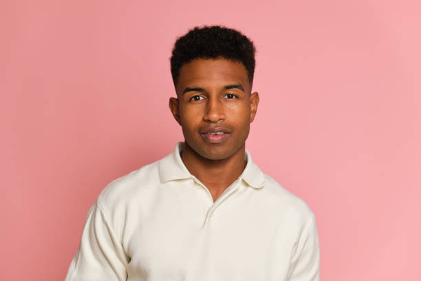 istock Young black man wearing white shirt smiling on pink background 2177818925