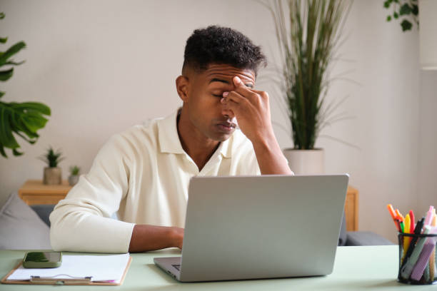 istock Young freelancer feeling tired and frustrated working from home office 2177819404