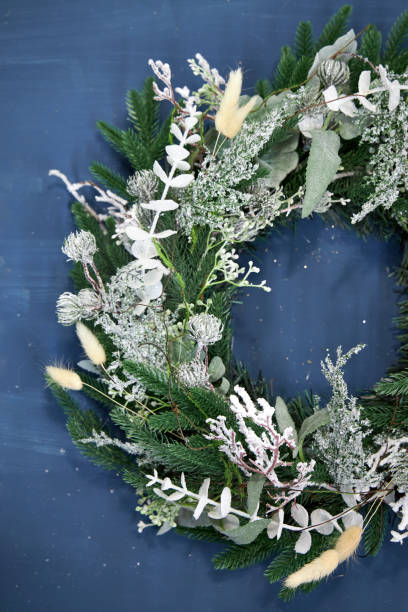 istock Christmas wreath of white needles on a blue background 2177819448