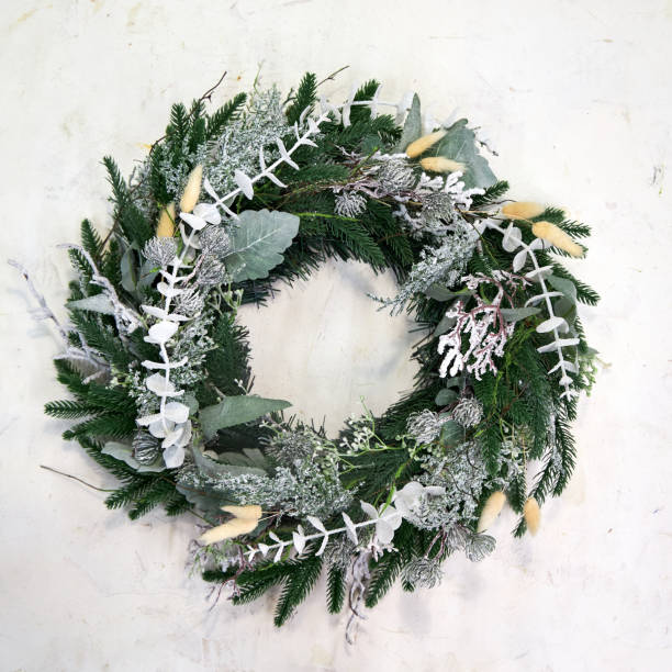 istock white pine needle Christmas wreath on a white background 2177819454