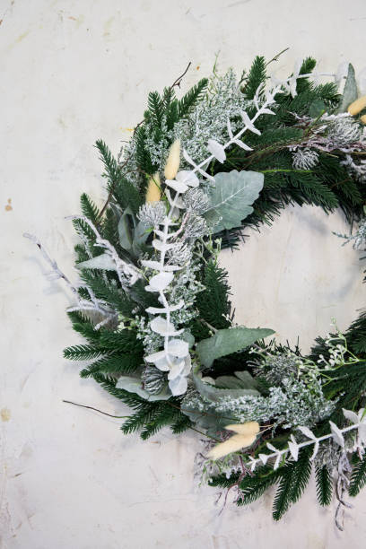 istock white pine needle Christmas wreath on a white background 2177819460