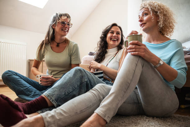 istock A modern mother enjoys a coffee while spending time with her two daughters. 2177819479