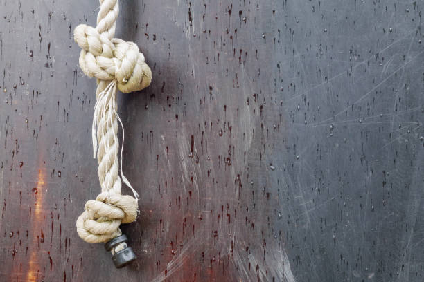 white thick rope with a knot on a brown background