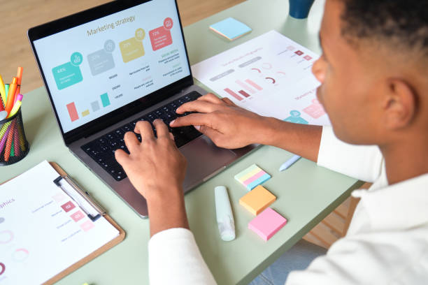 istock Marketing manager working on laptop with graphs and charts 2177819924