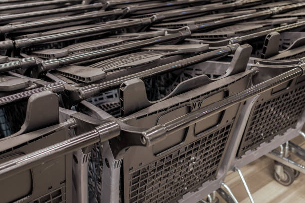 istock Rows of empty grocery carts in a supermarket 2177821468