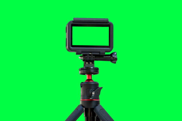 istock Action camera with empty screen on a mini tripod. Action cam installed on tripod with green screen background 2177824269