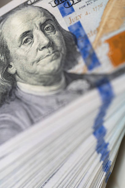 istock Pile of US 100 dollar banknotes on dollars background 2177824847
