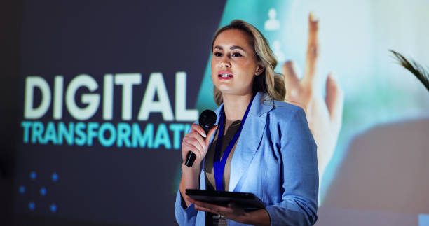 istock Stage, presentation and woman at seminar with microphone, tablet and speaker on digital transformation. Ideas, change and presenter at conference on future business development plan with technology 2177825903