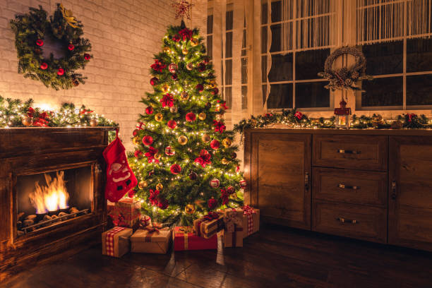 istock Decorated Christmas tree near fireplace 2177826541