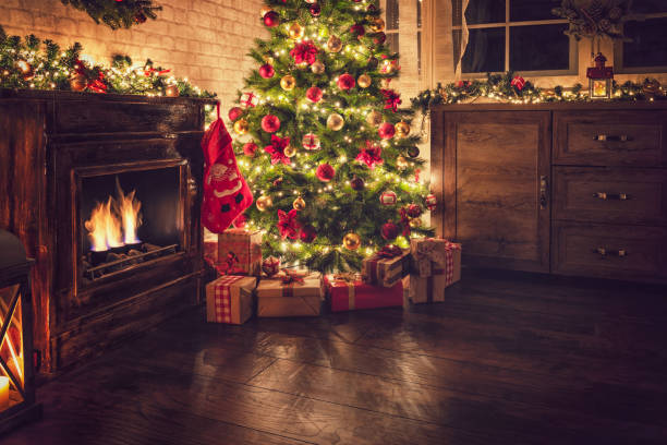 istock Decorated Christmas tree near fireplace 2177826545