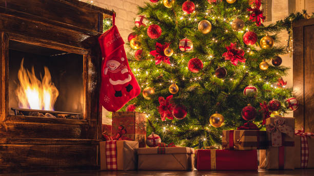 istock Decorated Christmas tree near fireplace 2177826546