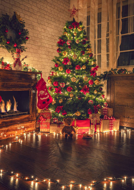 istock Decorated Christmas tree near fireplace 2177826569