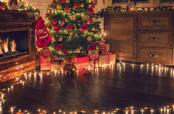 istock Decorated Christmas tree near fireplace 2177826580