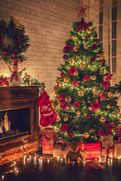 istock Decorated Christmas tree near fireplace 2177826584