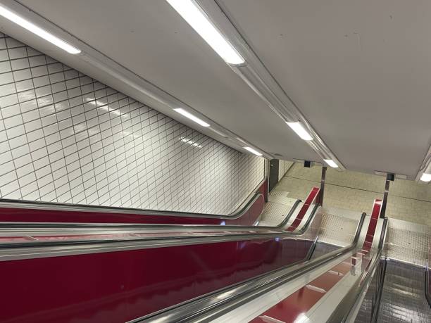 An empty red escalator to the metro underground in Hamburg with no person
