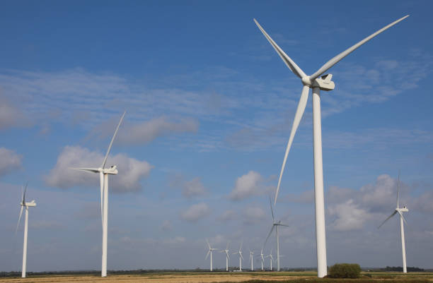 istock wind turbine with three blades rotating using wind power to produce electricity with zero environmental impact installed in a field 2177831335