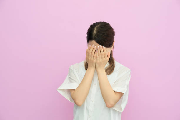 istock Young woman holding her head 2177832685