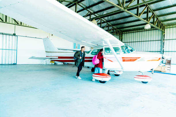 istock People boarding a private jet at airplane hangar 2177832847